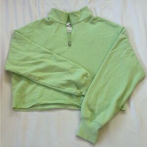 fits well, cropped, larger, a subtle neon green.